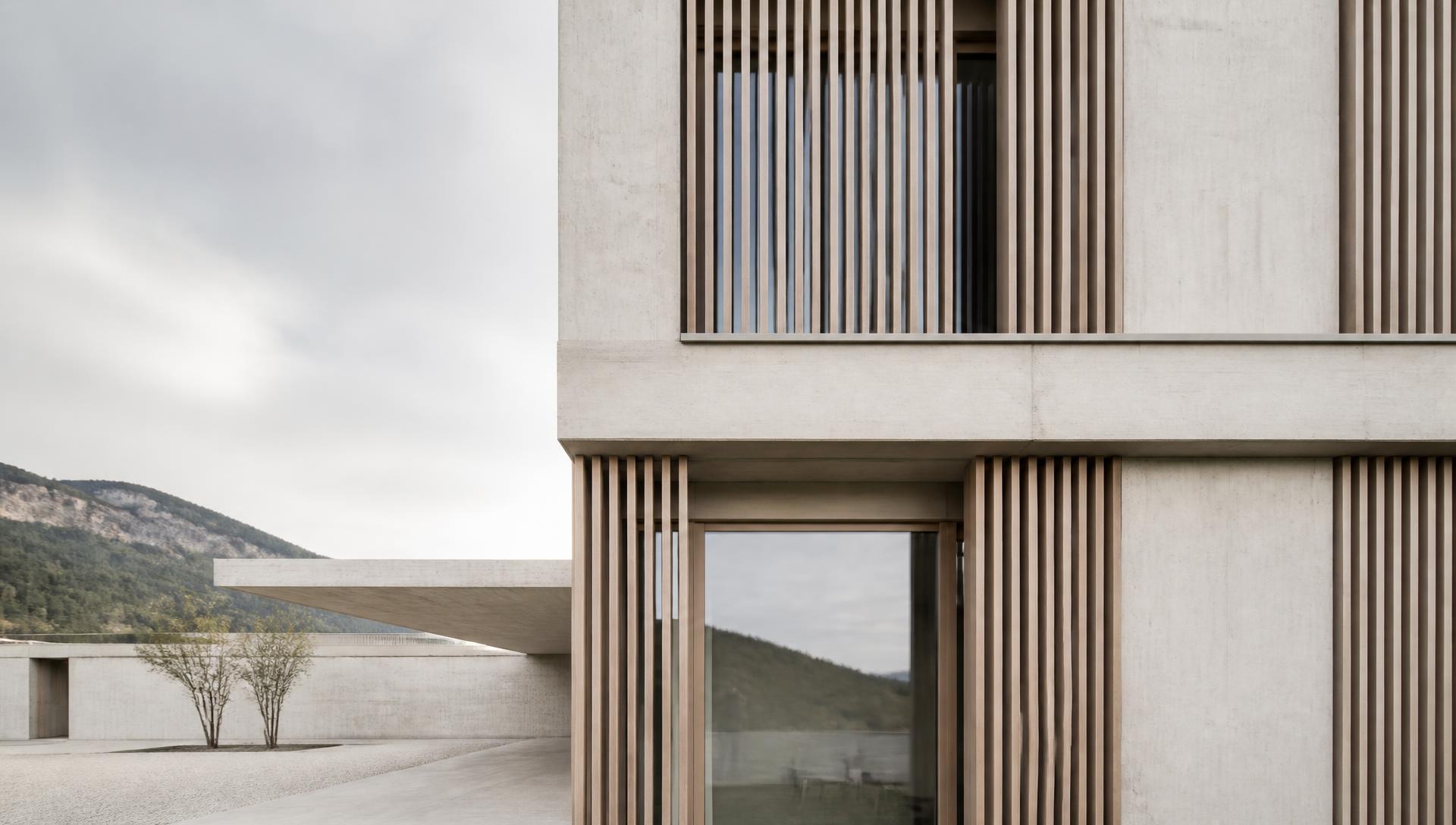 Concrete and timber facade of a KITHOMEX project